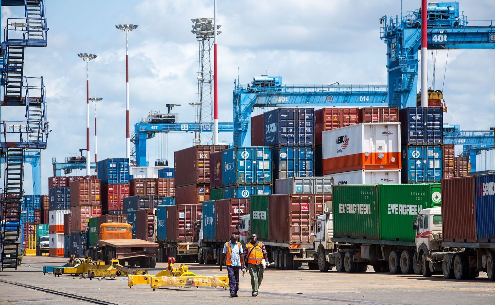 Containers, trucks and ship-to-shore cranes at the Port of Mombasa